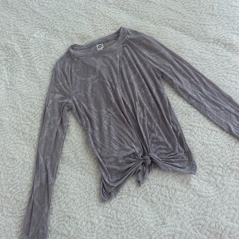 Joylab long sleeve work out top with slit opening in the front.